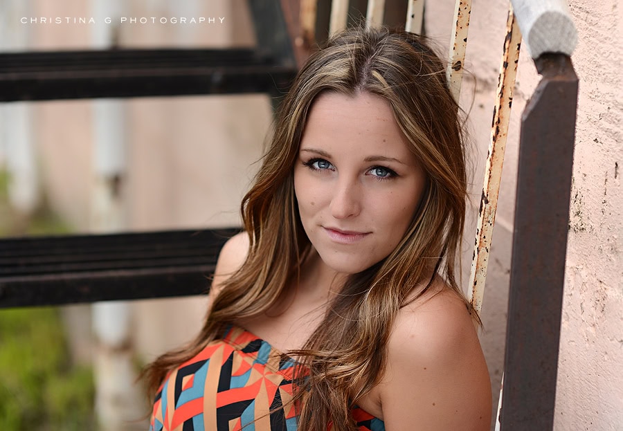 PRETTY TEEN GIRL SITTING ON VINTAGE LOOKING STAIRS