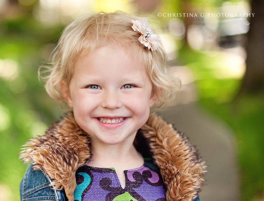 LITTLE BLONDE GIRL SMILING