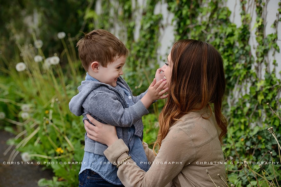 MOM & SON IN FRONT OF VINE WALL SMILING