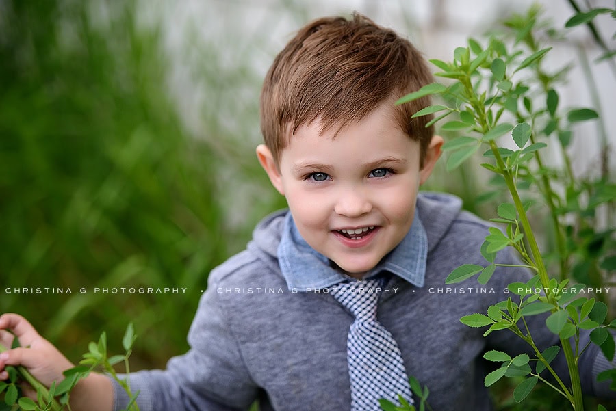 LITTLE BOY WITH TIE SMILING