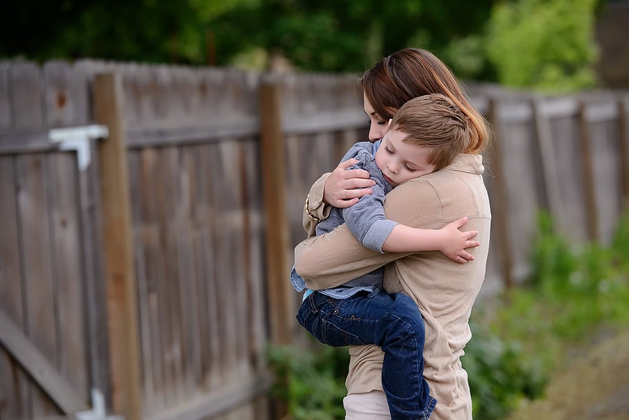 MOM HOLDING SON CLOSE