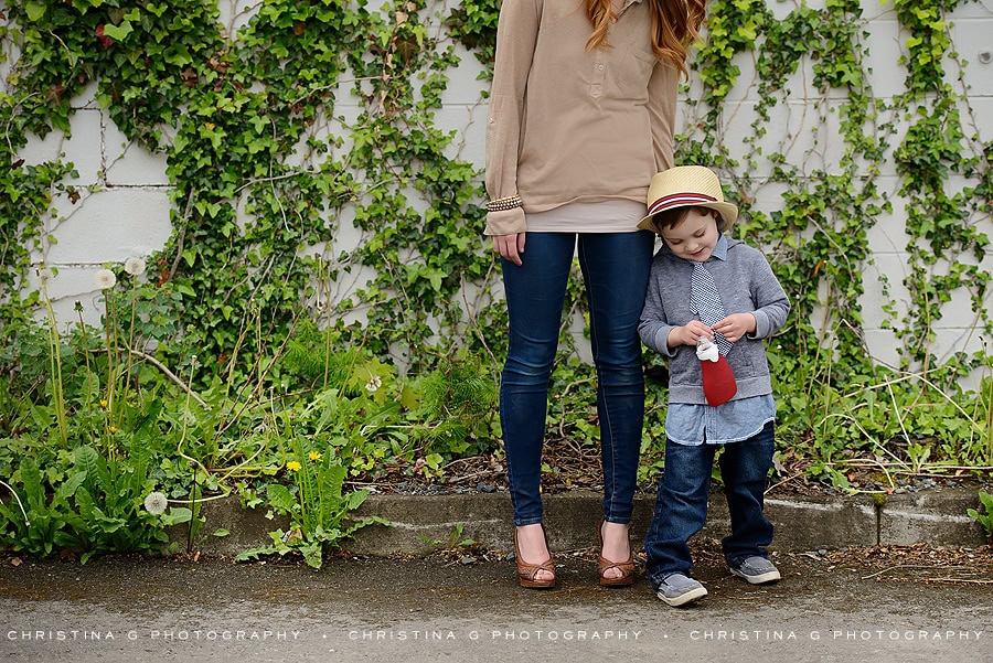 MOM & SON STANDING IN FRONT OF VINE WALL