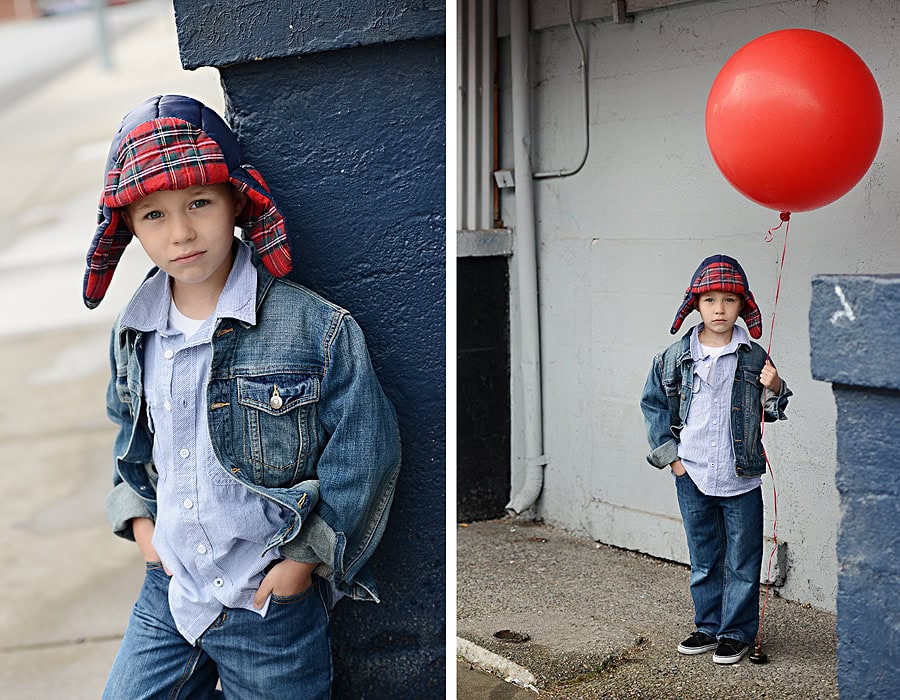 YOUNG BOY WITH PLAID HAT STANDING WITH BALLOON IN MIDTOWN COEUR D'ALENE